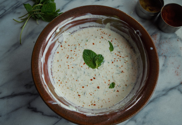 Cool cucumber and mint raita-- a common side dish or a condiment in India. |www.cookeatlaugh.com