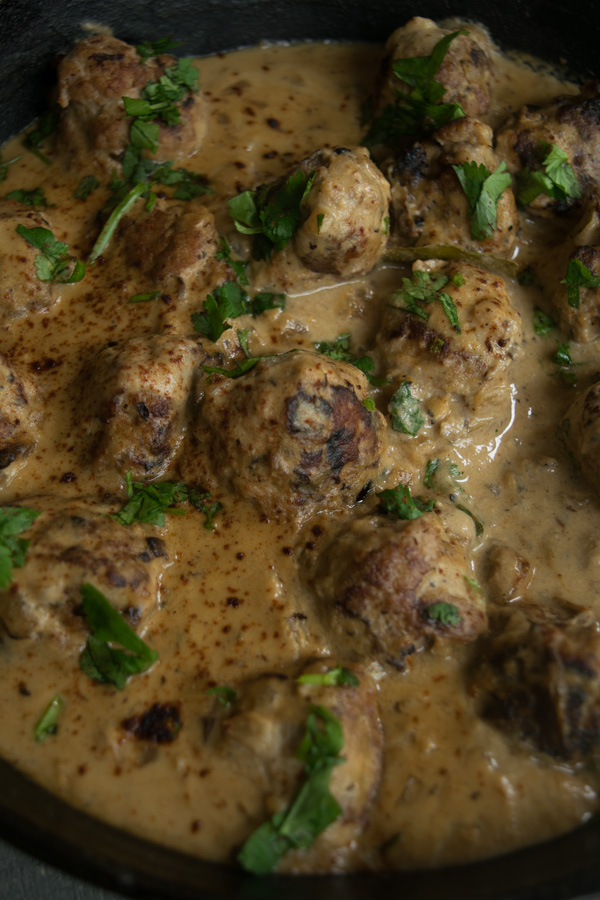 One pan meatballs with cashew cream sauce--a simple weeknight dinner which is packed full of flavor, easy to make, and delicious to eat! |www.cookeatlaugh.com