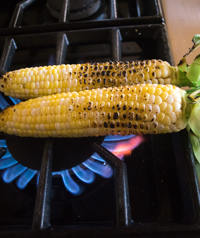 Grilled corn on the cob (Indian street style)--Simple, tangy, spicy, and salty grilled corn! |www.cookeatlaugh.com
