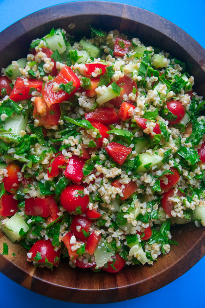 Mediterranean summer salad--nutritious salad filled with an array of vegetables, herbs, and tossed with a super simple dressing! |www.cookeatlaugh.com