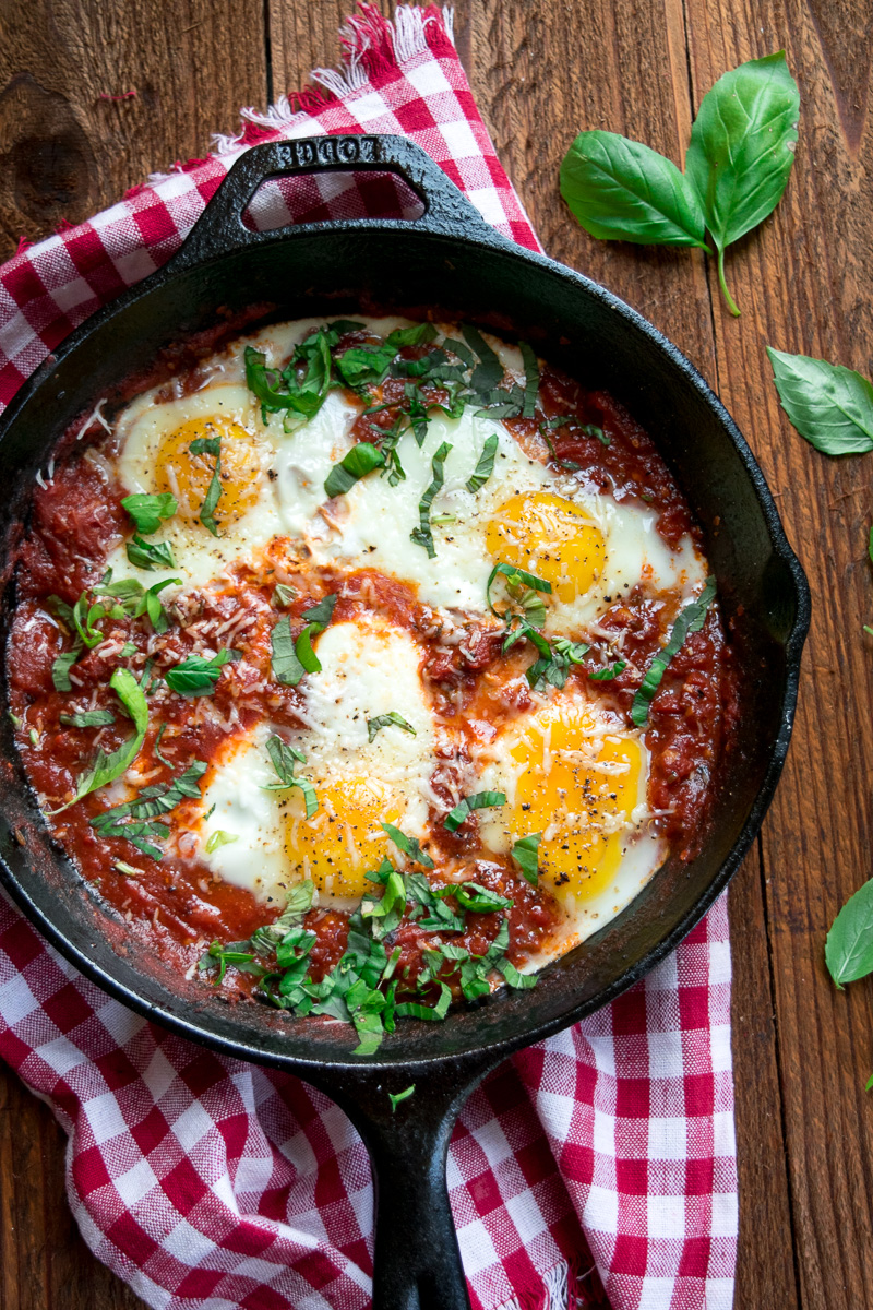 Eggs in purgatory-eggs are poached in a lip-smacking fiery tomato sauce that is meant to sopped up with a hunky slice of bread. |www.cookeatlaugh.com