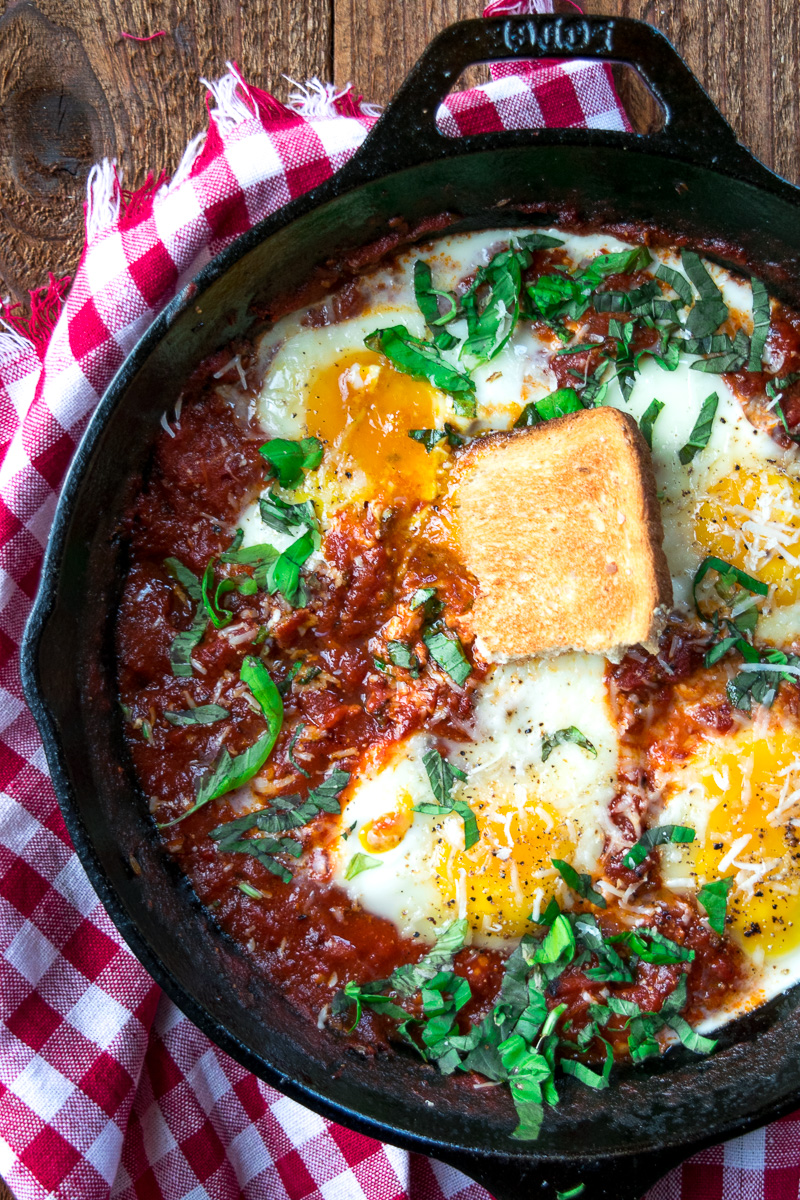 Eggs in purgatory-eggs are poached in a lip-smacking fiery tomato sauce that is meant to sopped up with a hunky slice of bread. |www.cookeatlaugh.com