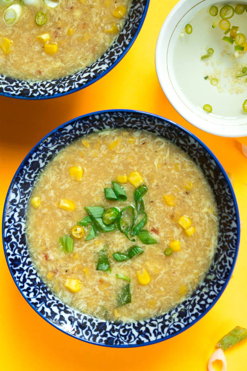 Indo chinese sweet corn soup with chili vinegar--a popular Indo Chinese soup which takes 20 minutes, one pot, and uses just a handful of ingredients.|www.cookeatlaugh.com
