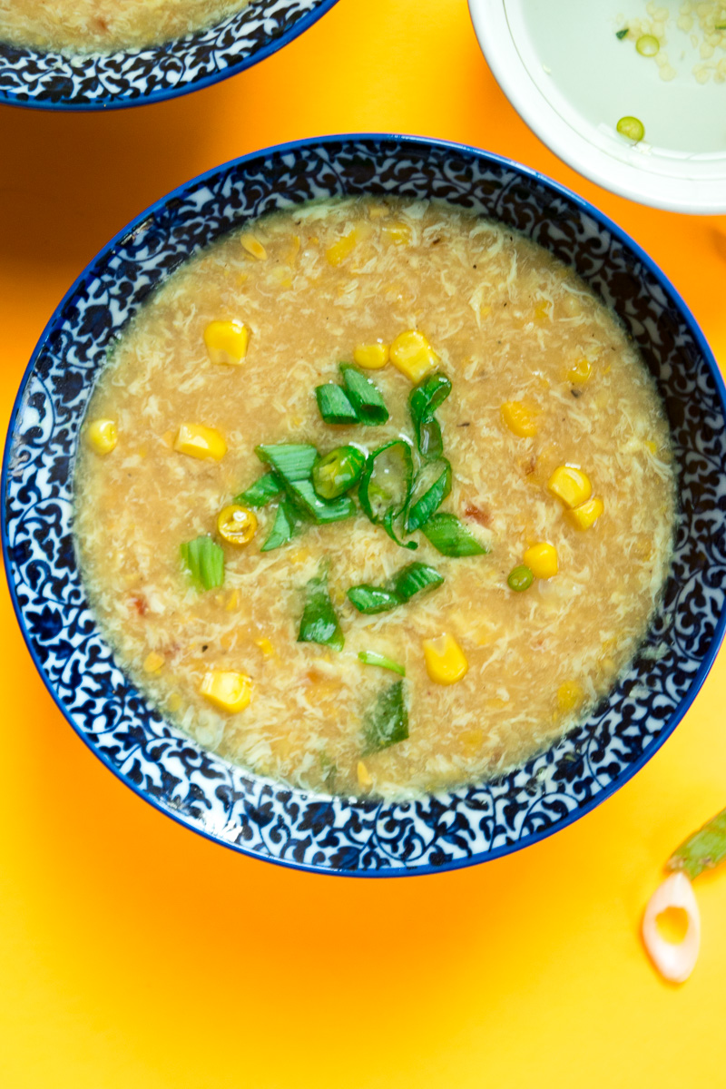 Indo chinese sweet corn soup with chili vinegar--a popular Indo Chinese soup which takes 20 minutes, one pot, and uses just a handful of ingredients.|www.cookeatlaugh.com