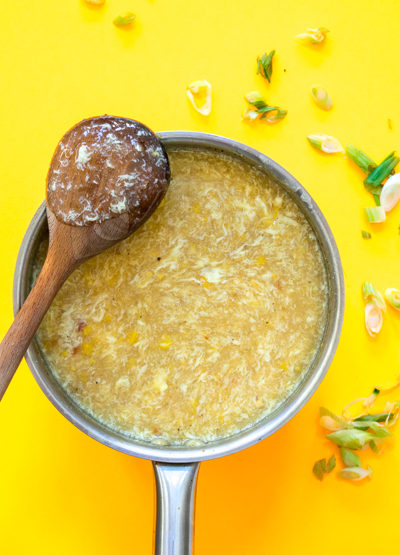 Indo chinese sweet corn soup with chili vinegar--a popular Indo Chinese soup which takes 20 minutes, one pot, and uses just a handful of ingredients.|www.cookeatlaugh.com