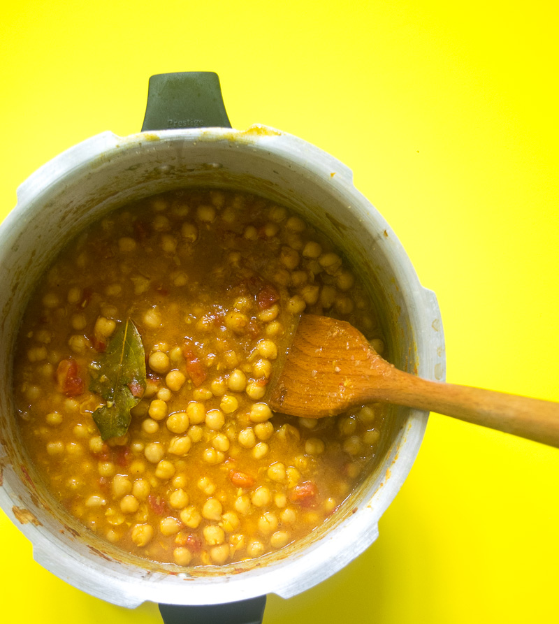 One pot chickpea stew (Indian Chana curry)--cooked in a rich tomato onion gravy that is spiced with cumin, coriander, turmeric, garam masala, and chili powder. |www.cookeatlaugh.com