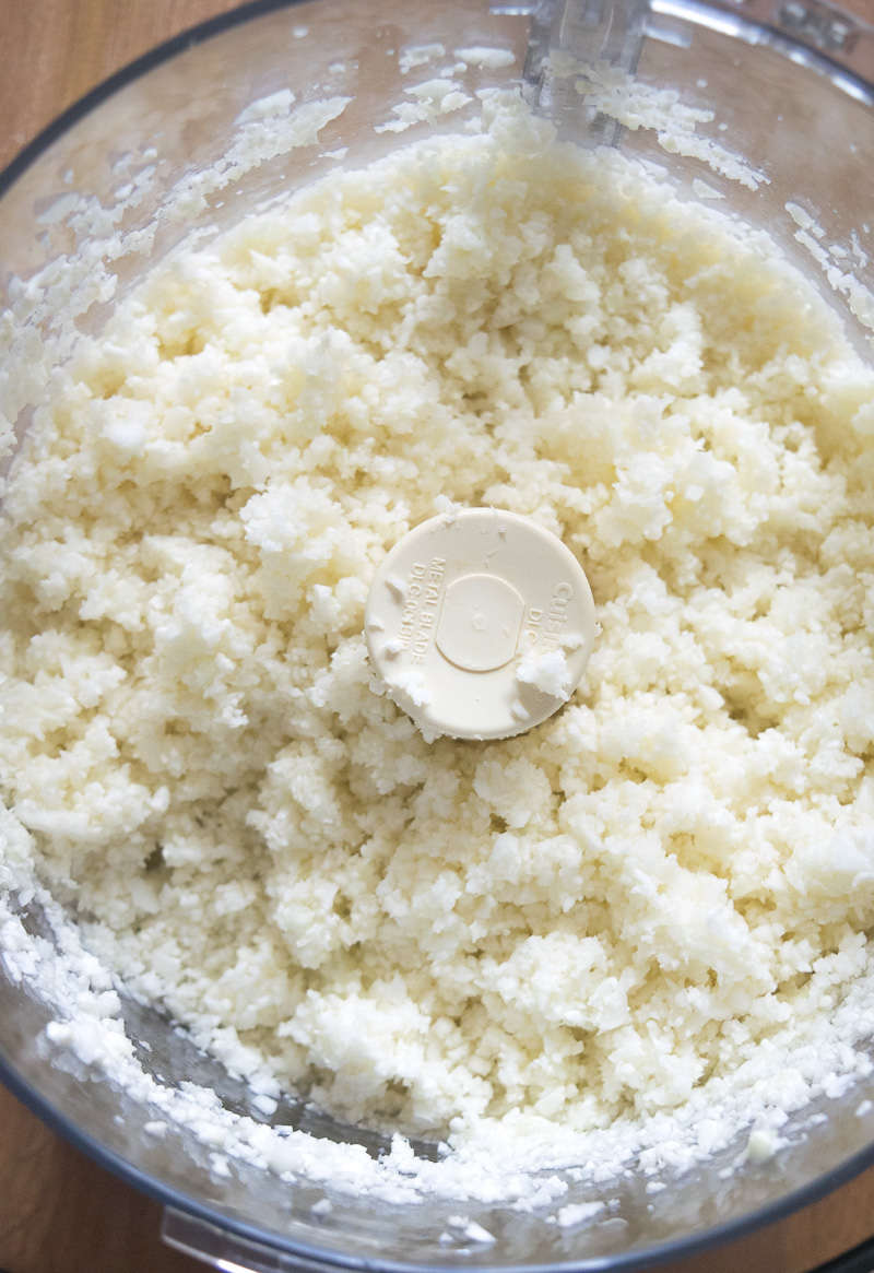 Quick 10-minute lemon cauliflower rice--Riced cauliflower tossed with aromatic Indian spices, so good you won't miss the rice! |www.cookeatlaugh.com