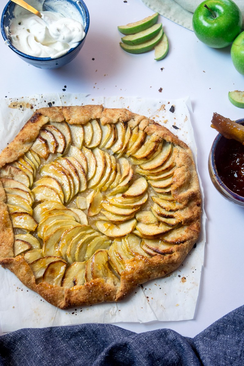 Rustic french style apple tart--a crispy crust, lightly sweetened apples, and butter. Super impressive, super delicious, and super easy to make. |www.cookeatlaugh.com