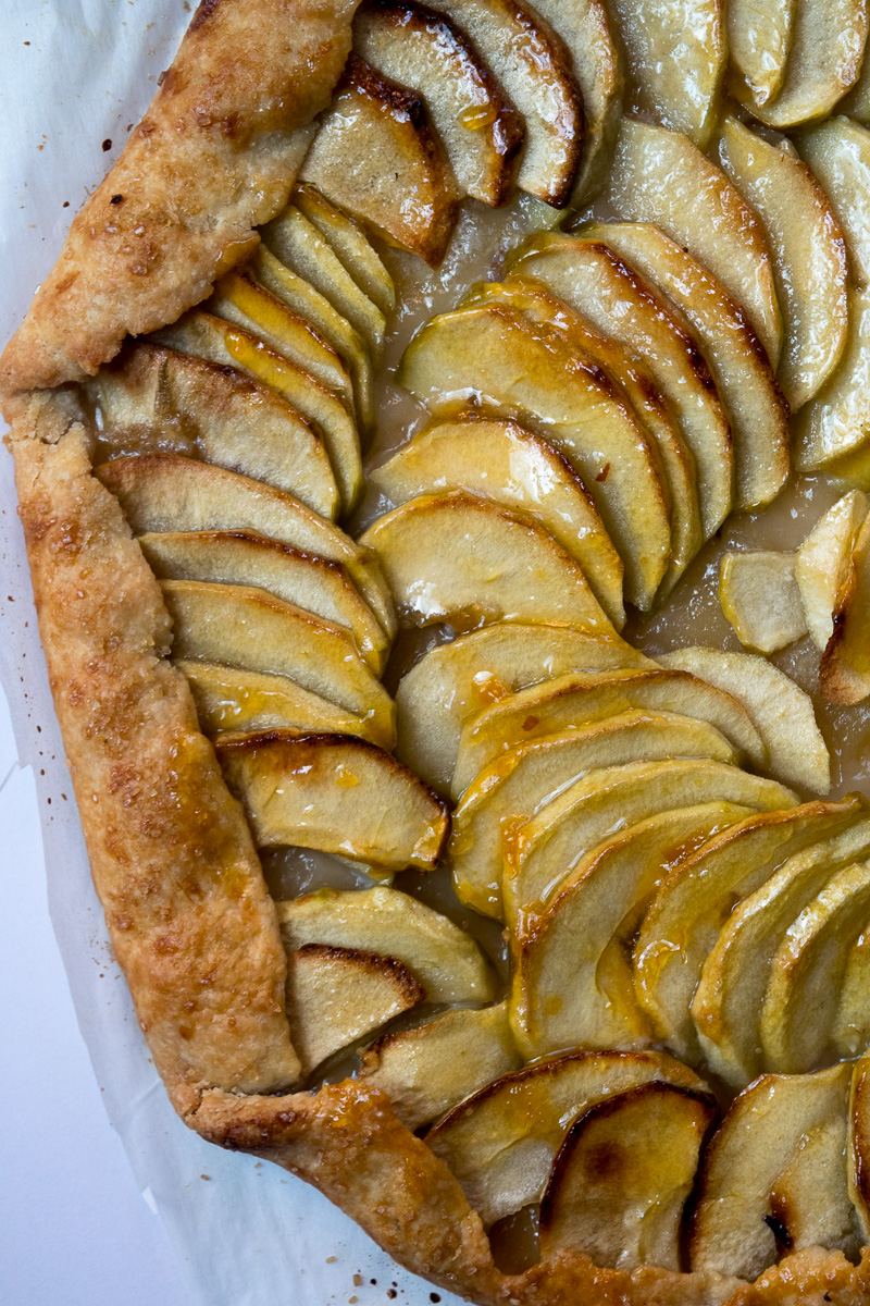 Rustic french style apple tart--a crispy crust, lightly sweetened apples, and butter. Super impressive, super delicious, and super easy to make. |www.cookeatlaugh.com