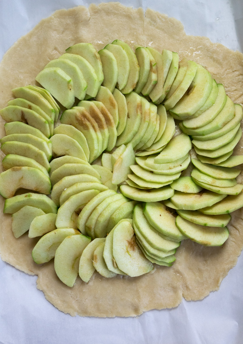 Rustic french style apple tart--a crispy crust, lightly sweetened apples, and butter. Super impressive, super delicious, and super easy to make. |www.cookeatlaugh.com