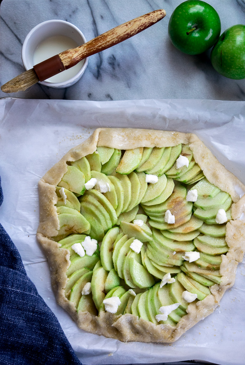 Rustic french style apple tart--a crispy crust, lightly sweetened apples, and butter. Super impressive, super delicious, and super easy to make. |www.cookeatlaugh.com