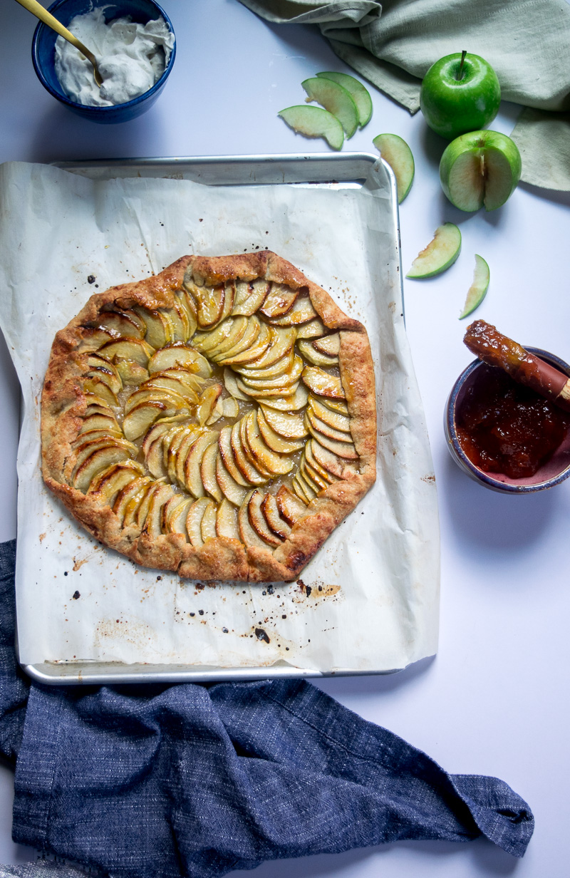 Rustic french style apple tart--a crispy crust, lightly sweetened apples, and butter. Super impressive, super delicious, and super easy to make. |www.cookeatlaugh.com