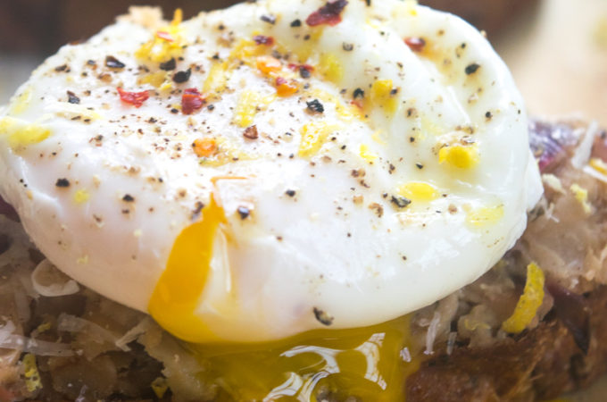 Smashed beans on toast with poached egg