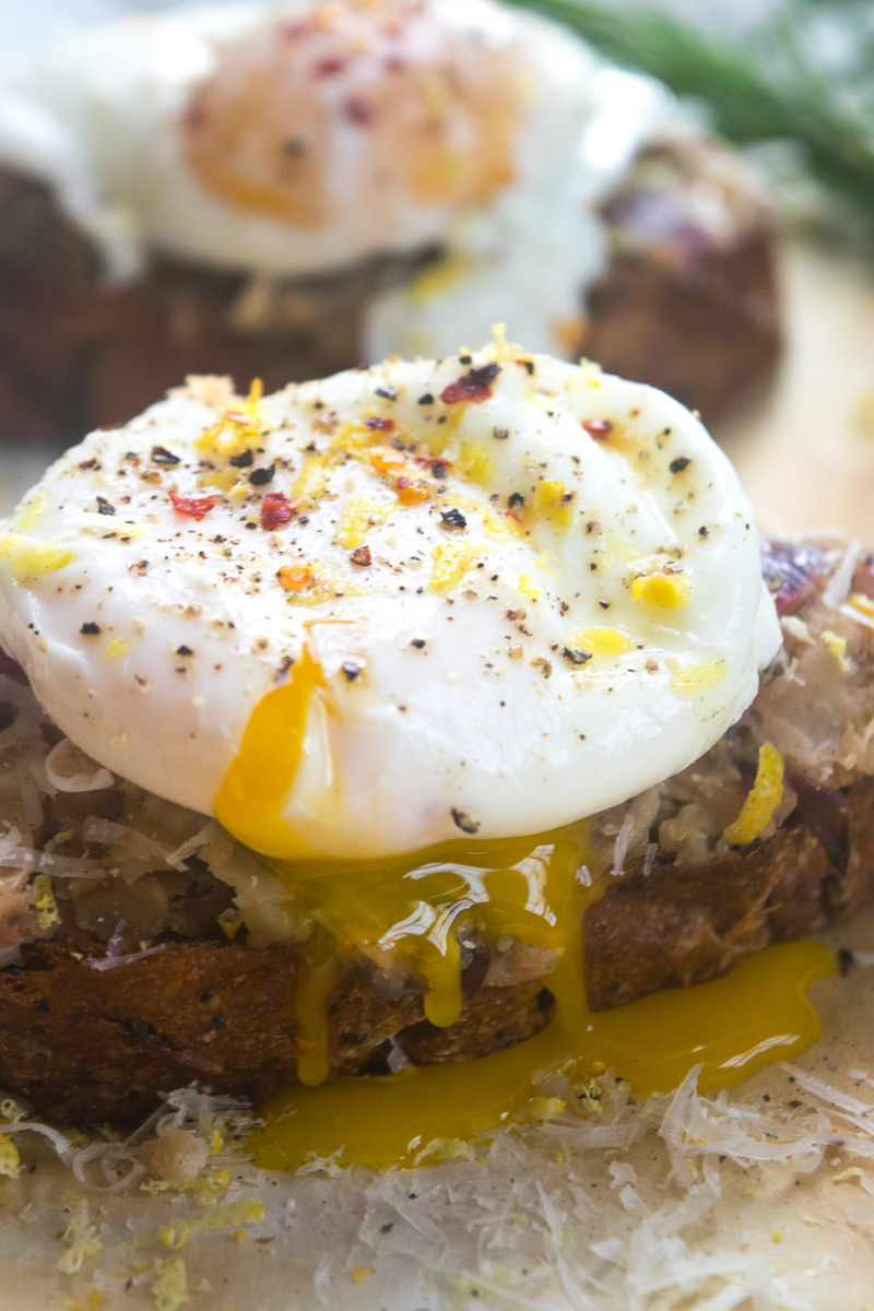 Smashed beans on toast with poached egg--Canned white beans tossed with spices, smashed on toast, topped with a perfeclty poached egg. |www.cookeatlaugh.com