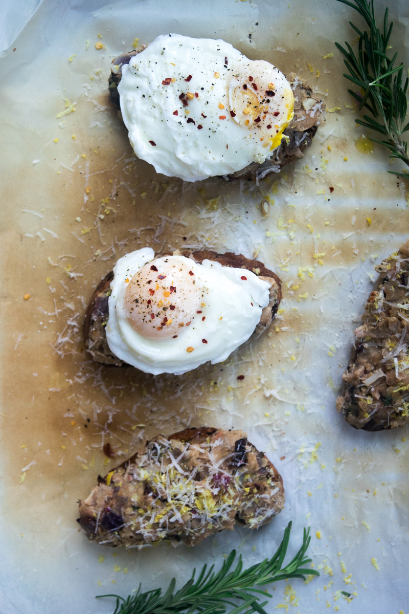 Smashed beans on toast with poached egg--Canned white beans tossed with spices, smashed on toast, topped with a perfeclty poached egg. |www.cookeatlaugh.com