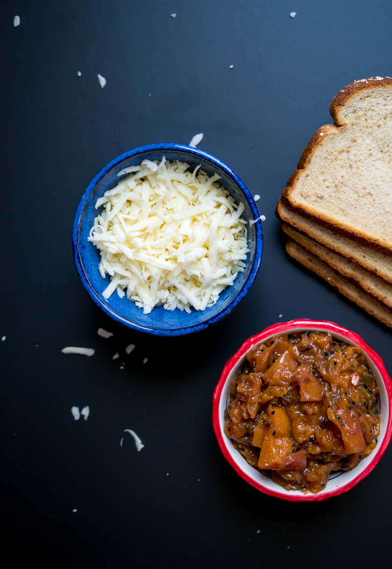 The ultimate sweet & savory grilled cheese--tangy sweet peach chutney and carmalized onions pairs perfectly with the ooey gooey melted cheese! |www.cookeatlaugh.com