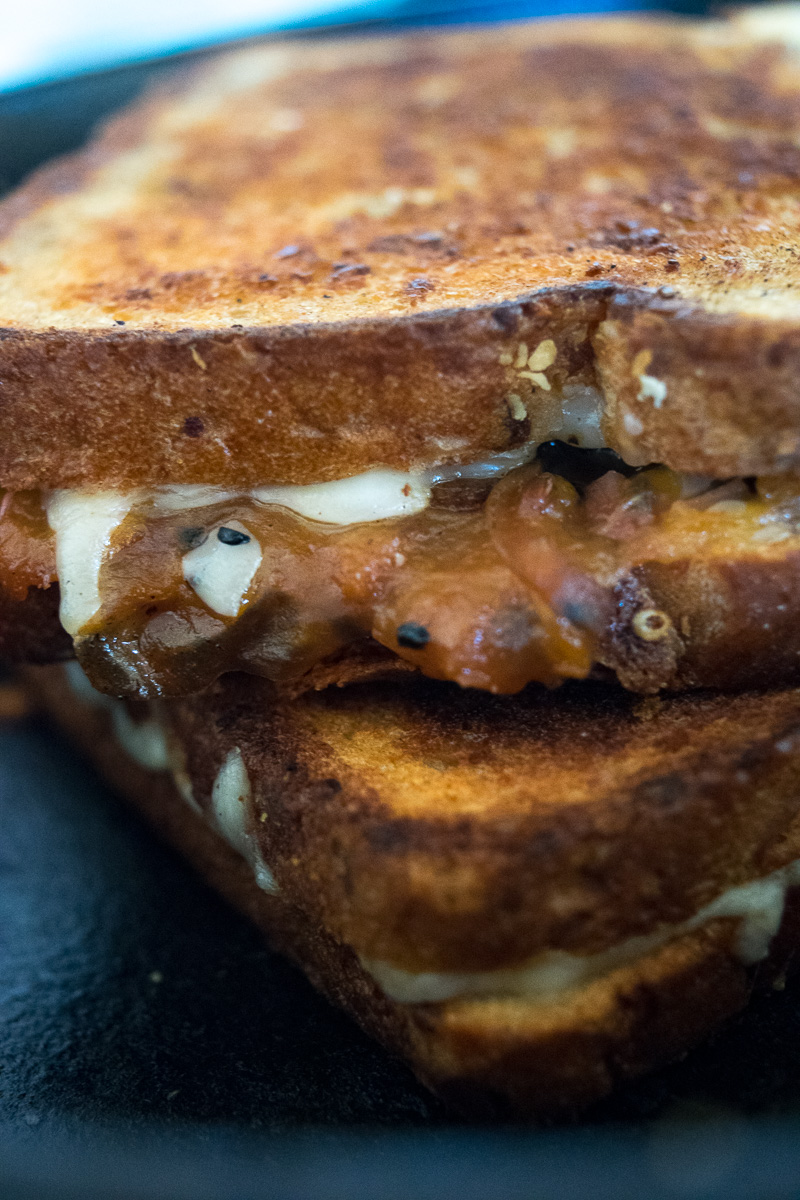 The ultimate sweet & savory grilled cheese--tangy sweet peach chutney and carmalized onions pairs perfectly with the ooey gooey melted cheese! |www.cookeatlaugh.com