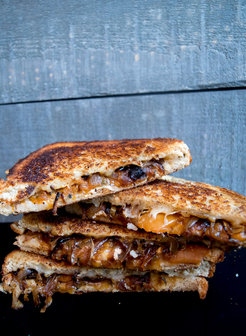 The ultimate sweet & savory grilled cheese--tangy sweet peach chutney and carmalized onions pairs perfectly with the ooey gooey melted cheese! |www.cookeatlaugh.com