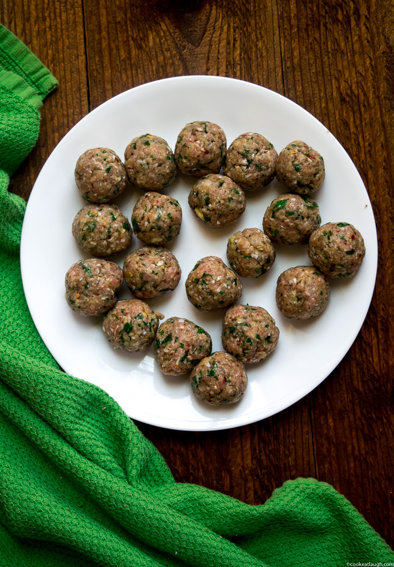 Spicy turkey meatballs in tomato sauce--it takes roughly 30 minutes to make and are super flavorful and juicy simmered in a simple tomato sauce! |www.cookeatlaugh.com -1