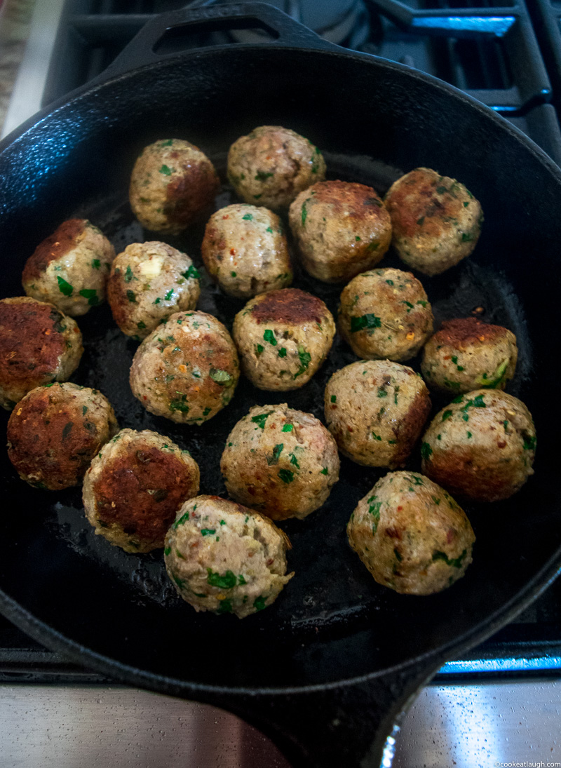 Spicy turkey meatballs in tomato sauce--it takes roughly 30 minutes to make and are super flavorful and juicy simmered in a simple tomato sauce! |www.cookeatlaugh.com -2