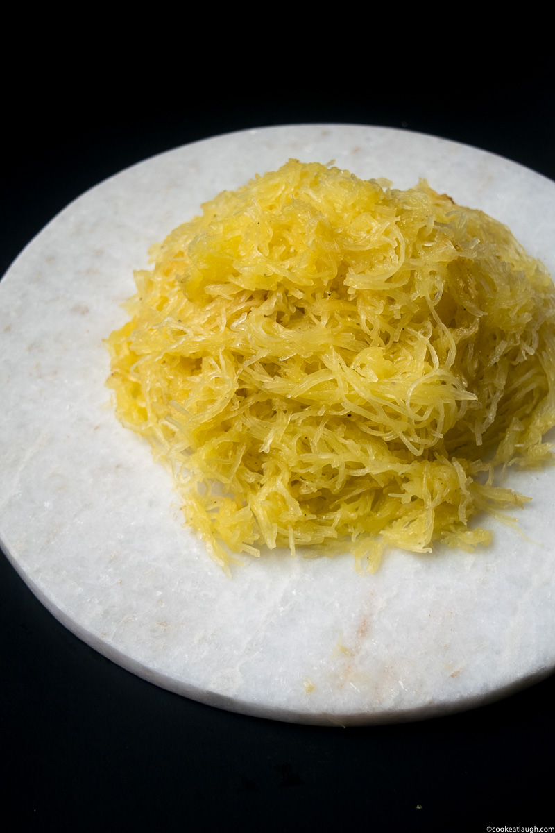 Lemon garlic spaghetti squash! is an incredibly flavorful dish, that will satisfy your carb cravings. It’s gluten-free, vegan, and low-carb. |www.cookeatlaugh.com-3