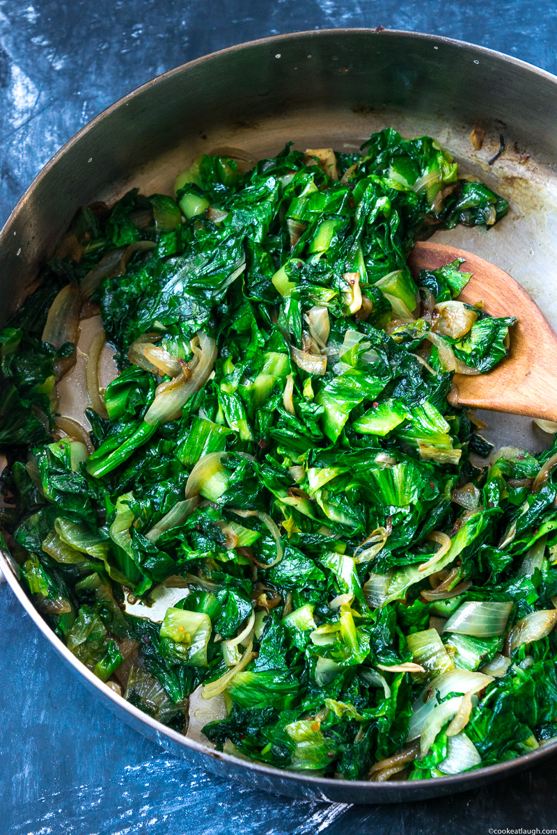 Sautéed escarole makes for a great healthy side dish. My favorite way is to quickly sauté it with onions, garlic, and chili flakes.|www.cookeatlaugh.com-7