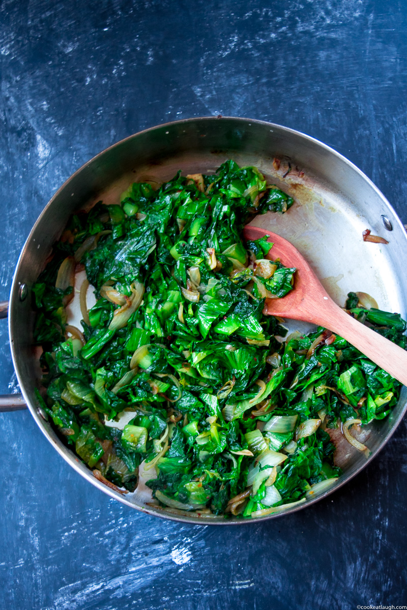 Sautéed escarole makes for a great healthy side dish. My favorite way is to quickly sauté it with onions, garlic, and chili flakes.|www.cookeatlaugh.com-8-3